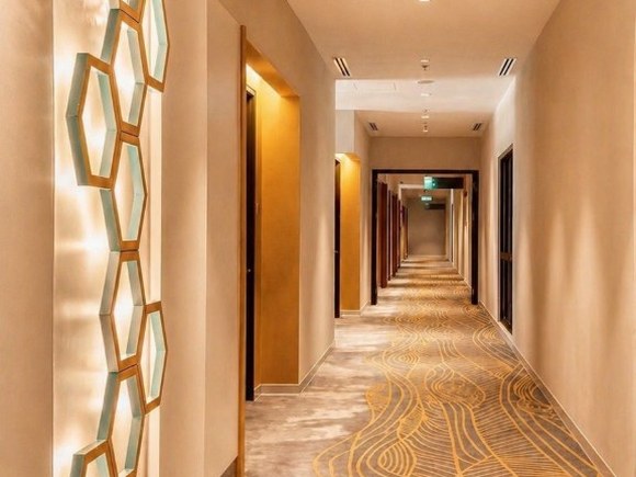Setia Point Hotel corridor with hexagonal wall lighting